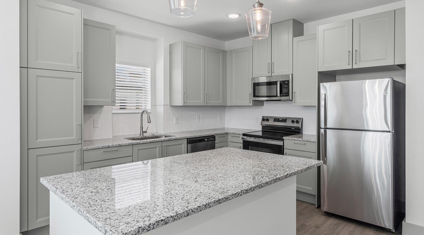 a kitchen with a granite counter top