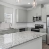 a kitchen with a granite counter top
