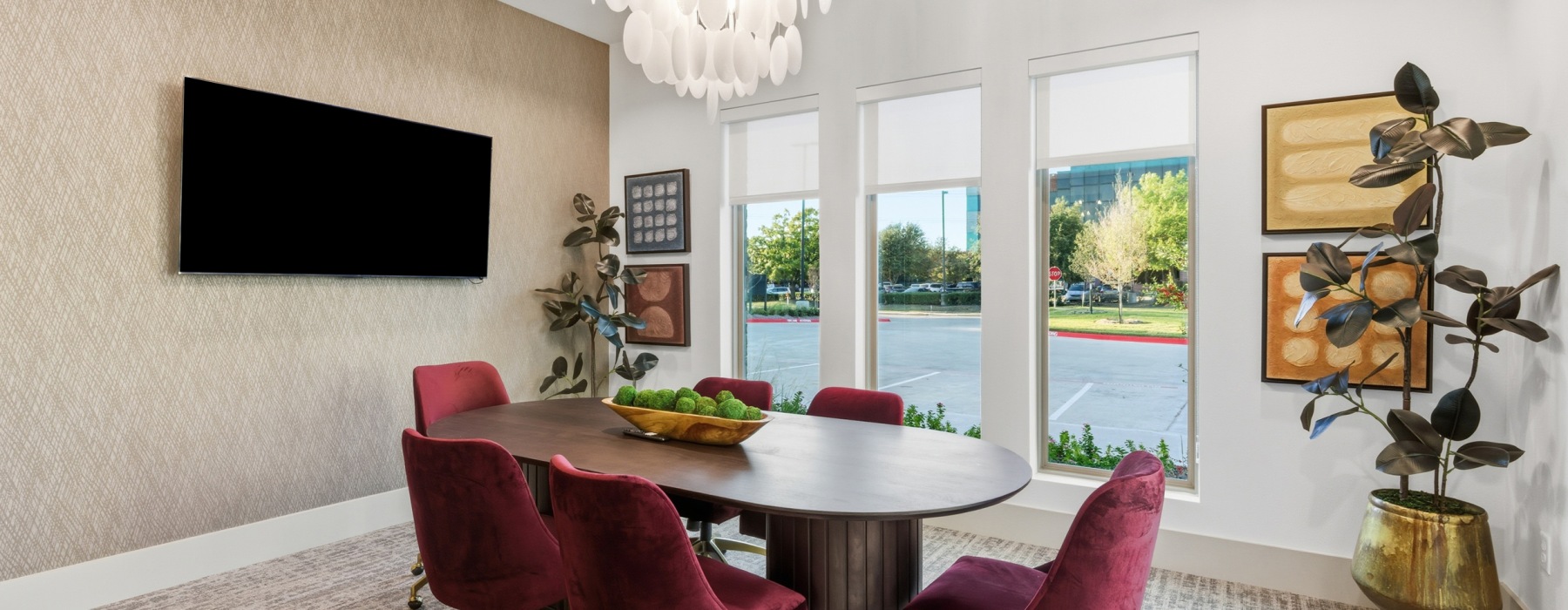 conference room with table chairs tv