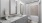 bathroom with tub and mirrors