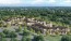 an apartment complex surrounded by trees