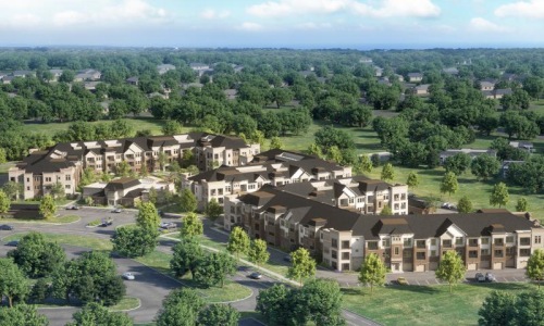 an apartment complex surrounded by trees