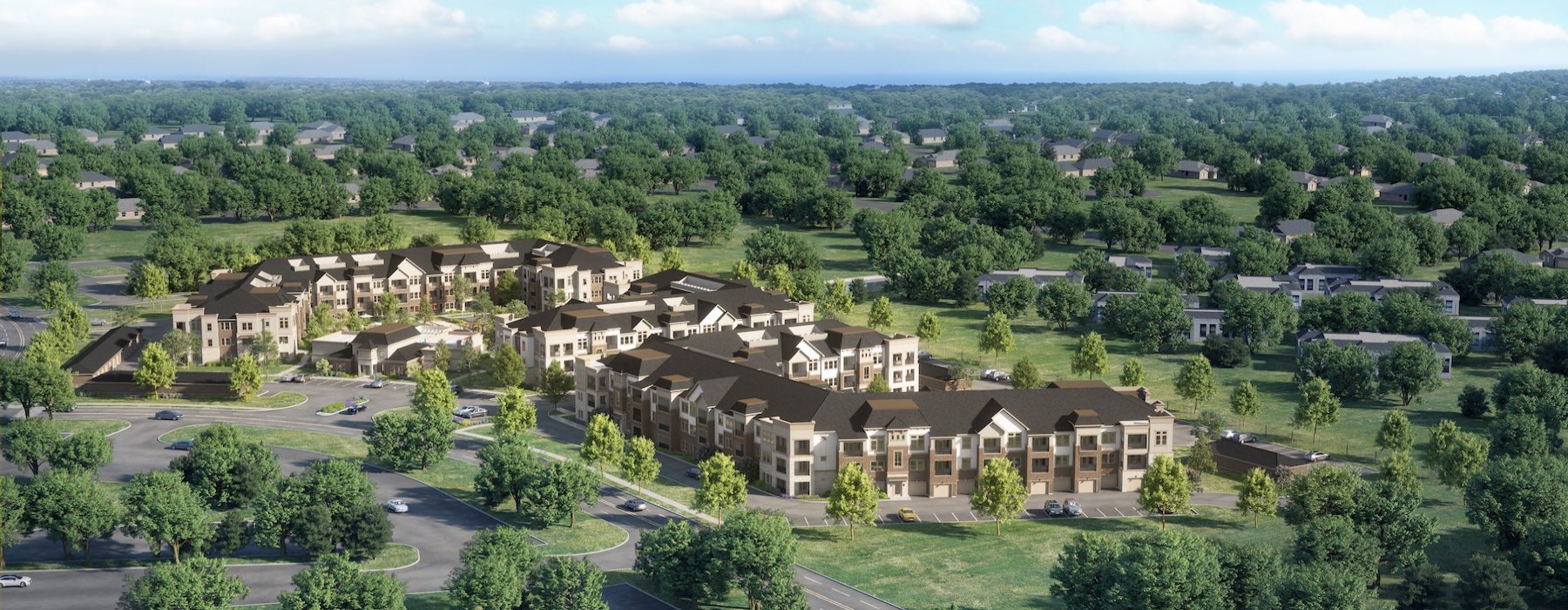 an apartment complex surrounded by trees