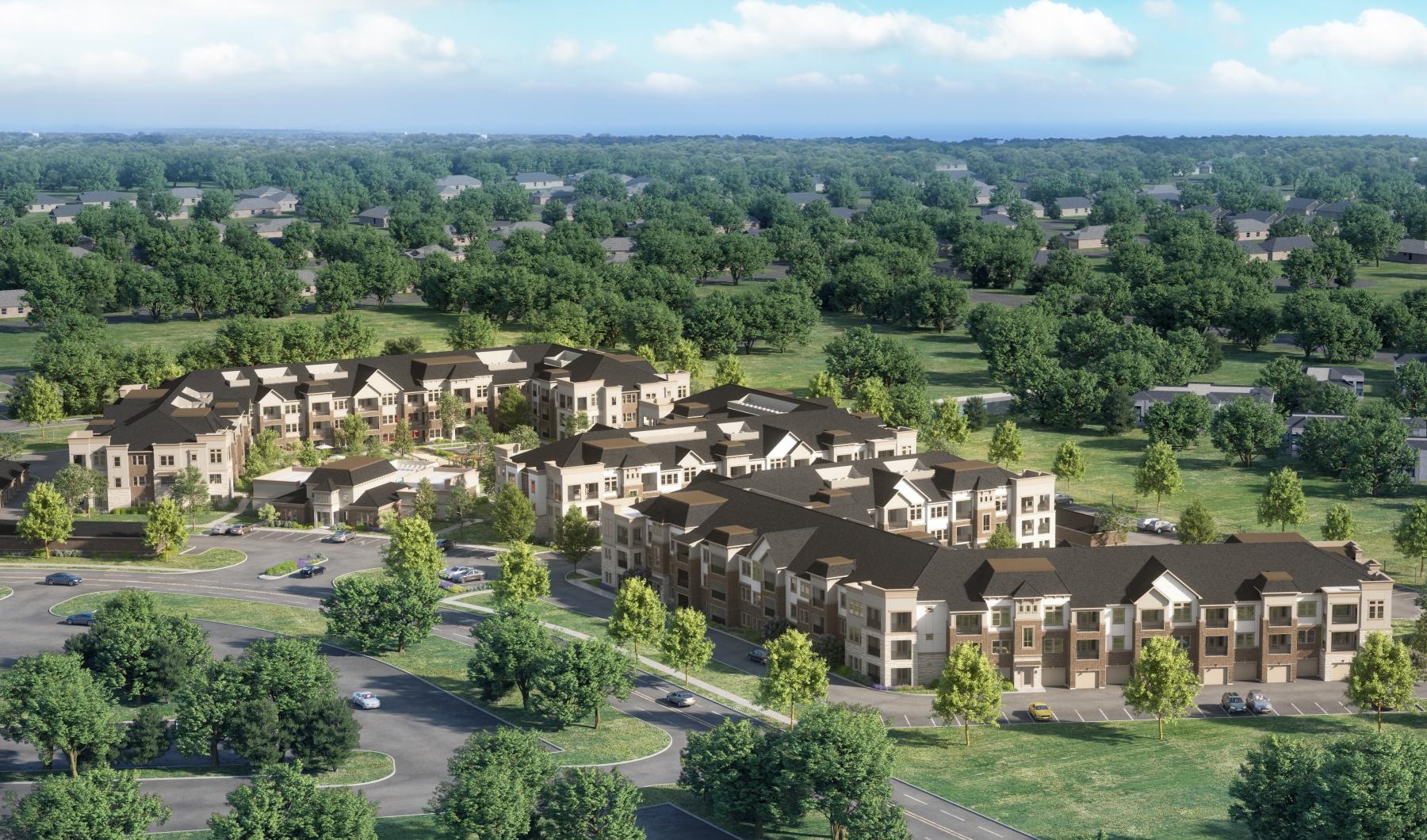 an apartment complex surrounded by trees